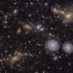 This image shows another small section of nsf doe vera c. rubin observatory's total view of the virgo cluster. visible are two prominent spiral galaxies (lower right), three merging galaxies (upper right), several groups of distant galaxies, many stars in