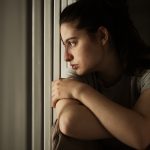 Young woman having a mental breakdown at home.